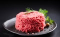 Fresh minced meat ground beef on a black plate