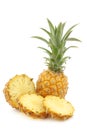 Fresh mini pineapple fruit and a cut one