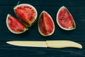 Fresh mini Watermelon slices on dark wooden background