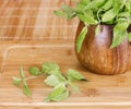 Fresh mint in a wooden brown bowl on the table Royalty Free Stock Photo