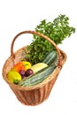 Fresh mint, yellow and green zucchini, bell peppers and burgundy Kerr chinese apples in basket Royalty Free Stock Photo