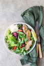 Fresh mix salad with grilled chicken fillet, avocado, apple and bell pepper and olive oil and lemon dressing. Healthy food, diet Royalty Free Stock Photo