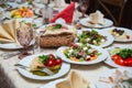 Fresh mix salad with ham, feta and mango on white plate. restaurant table setting Royalty Free Stock Photo