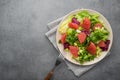 Fresh mix salad with lettuce, green arugula and sliced grapefruit in a plate Royalty Free Stock Photo