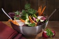 Fresh mix vegetable salad in metal plate on rustic wooden background. Organic food concept Royalty Free Stock Photo