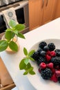 Fresh Mixed Berries with Mint Garnish. Royalty Free Stock Photo