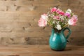 Fresh mixed flower in vintage jug Royalty Free Stock Photo