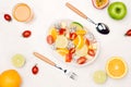 Fresh mixed fruit salad falling into a bowl of salad Royalty Free Stock Photo