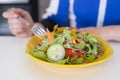 Fresh mixed tuna and vegetable salad in yellow plate Royalty Free Stock Photo