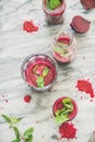 Fresh morning beetroot smoothie in glasses over grey marble background Royalty Free Stock Photo