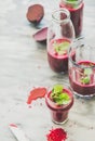 Fresh morning beetroot smoothie or juice in glasses, marble background Royalty Free Stock Photo