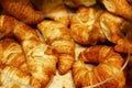 Fresh mouth-watering croissants on the counter. Close-up. Selective focus Royalty Free Stock Photo