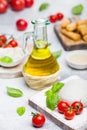 Fresh Mozzarella cheese on vintage chopping board with tomatoes and basil leaf with olive oil and tray with cheese sticks on stone Royalty Free Stock Photo