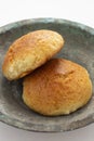 Fresh muffin in white background and old copper bowl