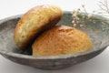 Fresh muffin in white background and old copper bowl