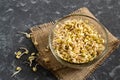 Fresh mung bean sprouts in glass bowl on gray background