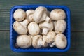 Fresh mushrooms champignons in a box. Top view Royalty Free Stock Photo