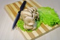 Fresh mushrooms with herbs on a wooden board.