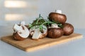 Fresh mushrooms royal champignons on a wooden board, background