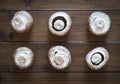 Fresh mushrooms on the wooden background, background, top view