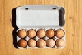 Fresh Natural healthy food and organic farming concept.Chicken eggs in carton box on wooden table.Top view Royalty Free Stock Photo