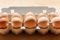 Fresh Natural healthy food and organic farming concept.Chicken eggs in carton box on wooden table.Top view Royalty Free Stock Photo