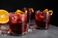 Fresh Negroni cocktails with orange zest on table Royalty Free Stock Photo