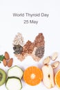 Fresh nutritious ingredients in shape of thyroid. Healthy food as source vitamins. World Thyroid Day and problems with thyroid