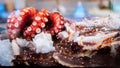 Fresh octopus and King crab legs on ice at Sushi bar Royalty Free Stock Photo