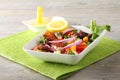 Fresh octopus salad with tomato and onion Royalty Free Stock Photo