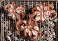 Fresh octopuses on the charcoal grill, Italy. Traditional Mediterranean cuisine