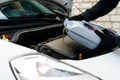 Fresh oil being poured during an oil change to car engine, close Royalty Free Stock Photo