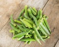 Fresh okras on wood background Royalty Free Stock Photo