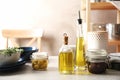 Fresh olive oil and kitchen utensils Royalty Free Stock Photo