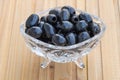 Fresh olives in the crystal cup. Benefits of olives