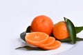 Fresh orange clementines cut in slices