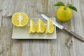 Fresh orange cut half in plate on wooden table Royalty Free Stock Photo