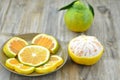 Fresh orange cut slices in plate on wooden background Royalty Free Stock Photo