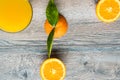 Fresh orange fruit with cut in half slice and green leaf glass of orange juice oisolated on wood background . Top view. Flat lay Royalty Free Stock Photo
