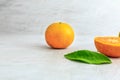 Fresh orange fruit cut in half on a white background Royalty Free Stock Photo