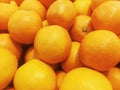 Fresh orange fruit pile on stall in supermarket Royalty Free Stock Photo