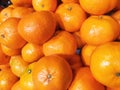 Fresh orange fruit pile on stall in supermarket Royalty Free Stock Photo