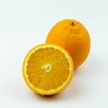 Fresh orange fruit with sliced and green leaves on white background Royalty Free Stock Photo