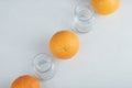 Fresh orange fruits with empty glass pitchers