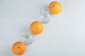 Fresh orange fruits with empty glass pitchers