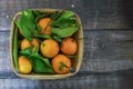 Fresh orange fruits in wooden box on wooden table. Royalty Free Stock Photo