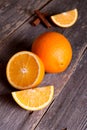 Fresh orange halves on rustic wooden kitchen table Royalty Free Stock Photo