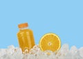 Fresh orange juice and cut slice on ice Royalty Free Stock Photo