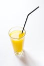 Fresh orange juice in glass with black tubule Royalty Free Stock Photo