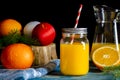 Fresh orange juice in a glass jar with a straw. Healthy fruits and juices Royalty Free Stock Photo